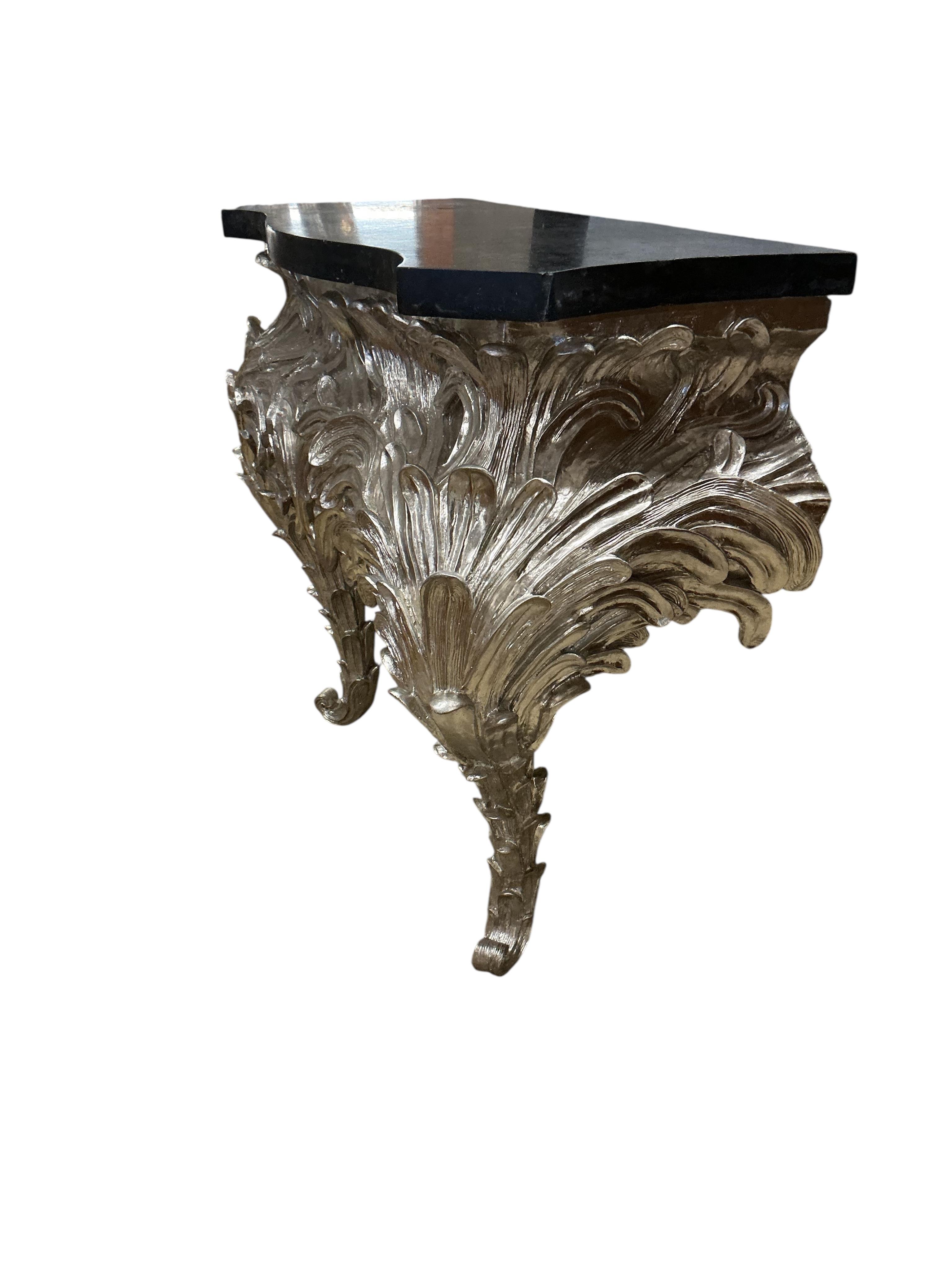 A pair of contemporary silvered composition serpentine 